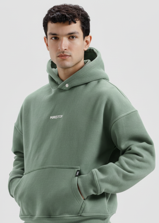 Man wearing a green hoodie on a white background