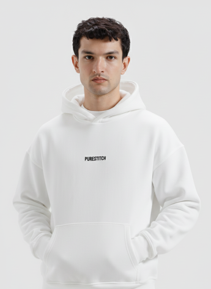 Man wearing a white hoodie with text on a light gray background