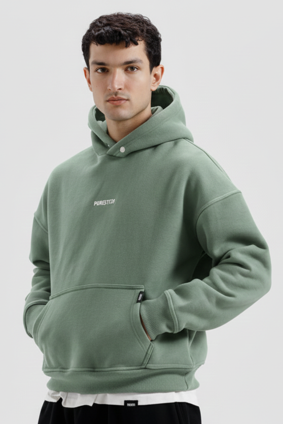 Man wearing a green hoodie on a white background